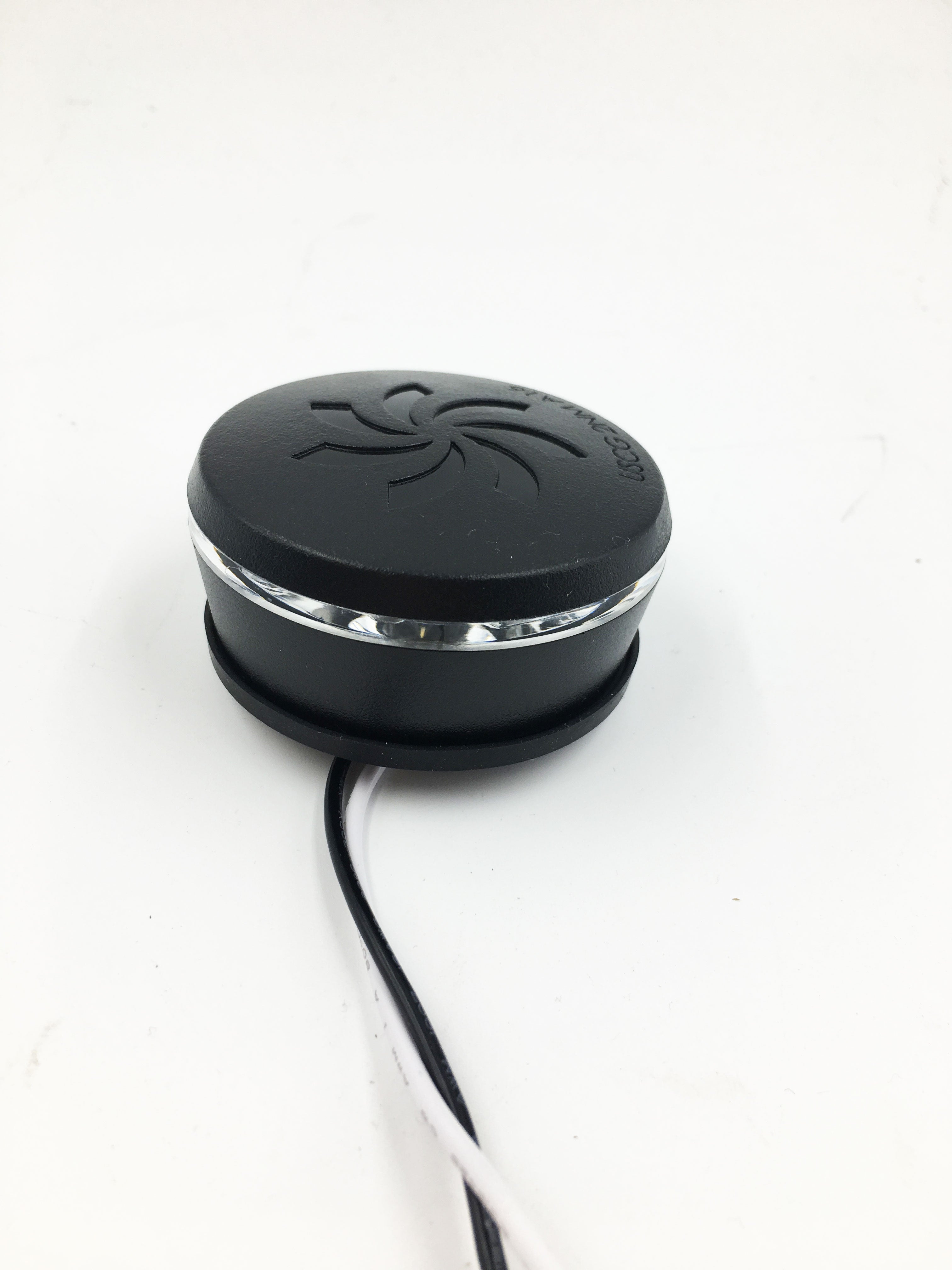 A Malibu Tower 2V LED All-Round Navigation White Light (4121014), round and black with a shiny silver band, embossed spider logo on top, and two wires at its base, is shown against a plain white background.