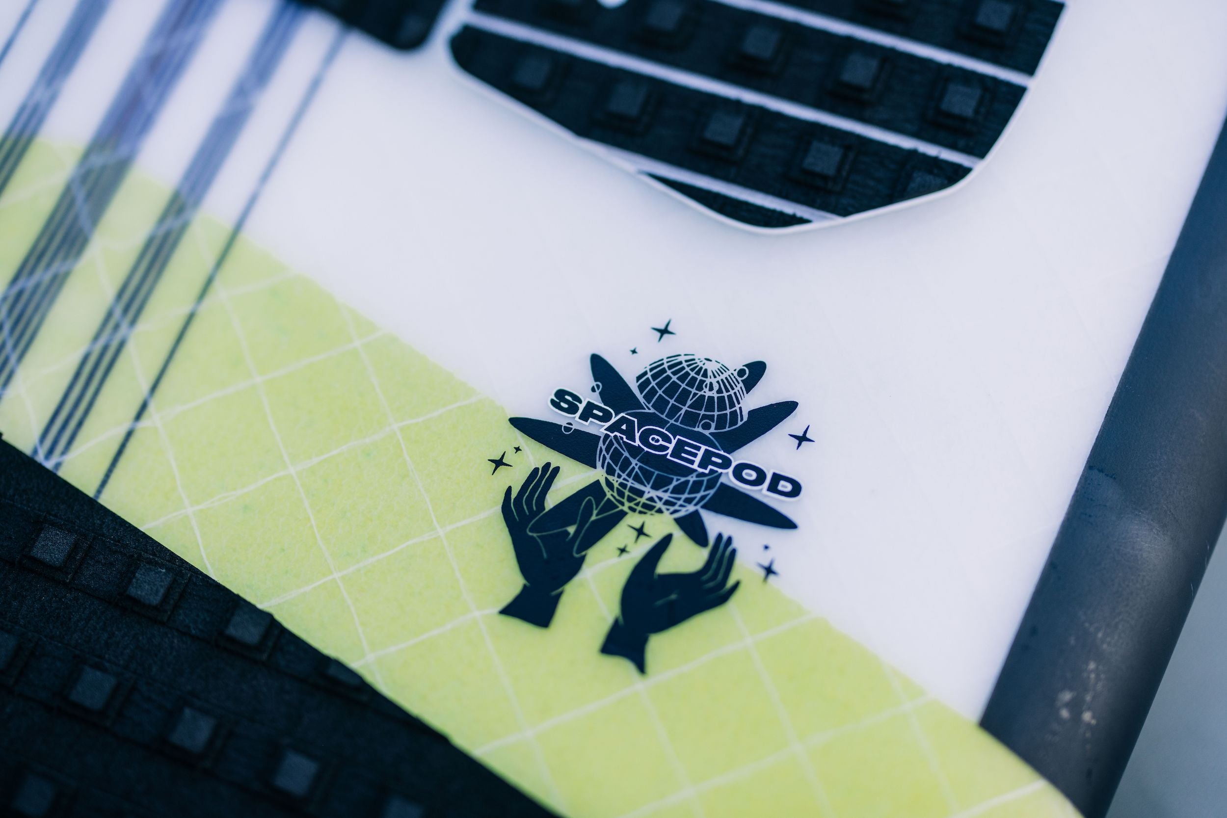 A Liquid Force 2023 Space Pod Wakesurf Board with a logo on it, designed specifically for maneuverability in wake surfboards.