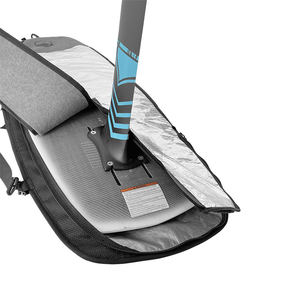 A Liquid Force Foil Board Bag - 4'4" lies open with a paddleboard inside, showcasing its sleek protective cover against a vibrant green background.
