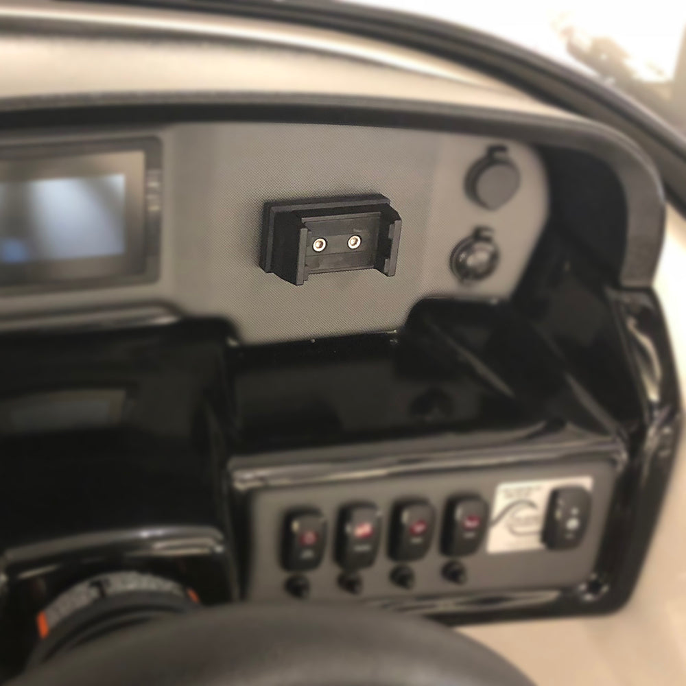 A close-up shows a PTM Edge PTM Rotating Phone Holder RPH-100 mounted with two screws on a clean, organized vehicle dashboard, alongside several control switches and a small screen on the left.