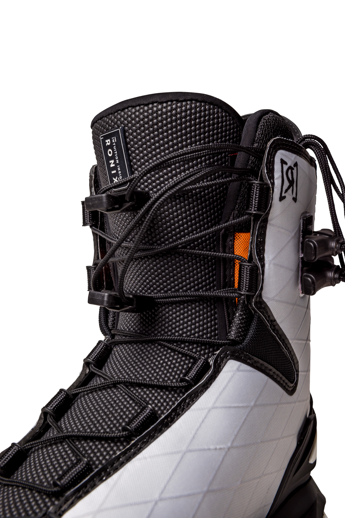 A pair of lightweight Ronix 2023 RXT Boots in white and orange on a black background.