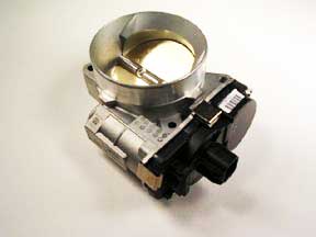 The Indmar 4 BOLT Etc Monovalve - 551391, a metallic throttle body with electronic control and a circular opening, is shown against a plain white background.