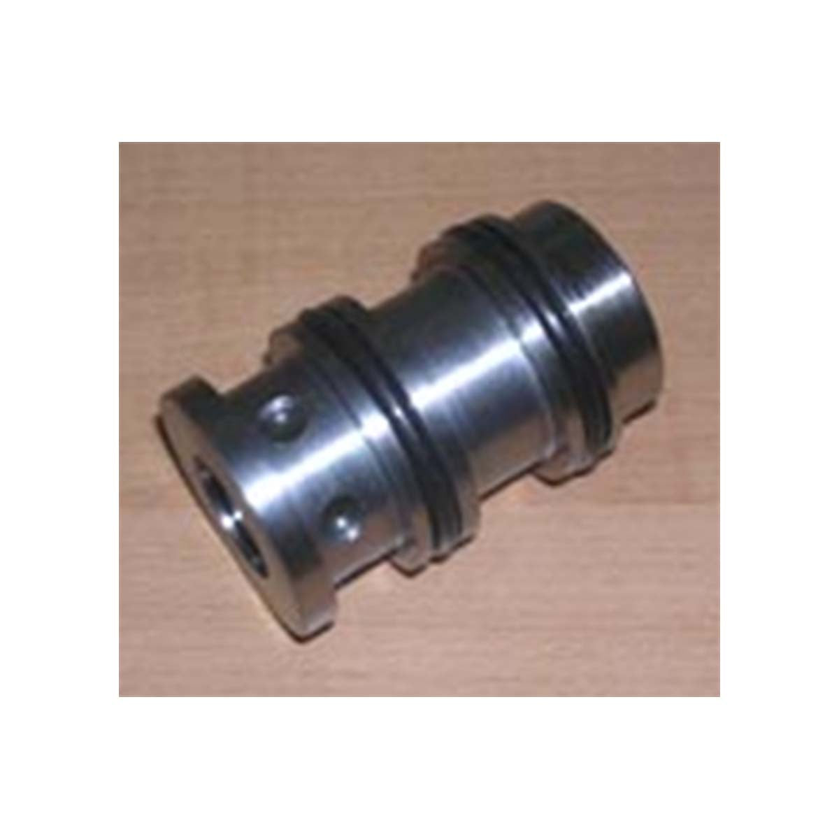 An Indmar SHIFT VALVE ELECTRIC V-DRIVE (VELVET DRIVE) - 083002, a cylindrical metal part with grooves and holes, is displayed on a light wooden surface.