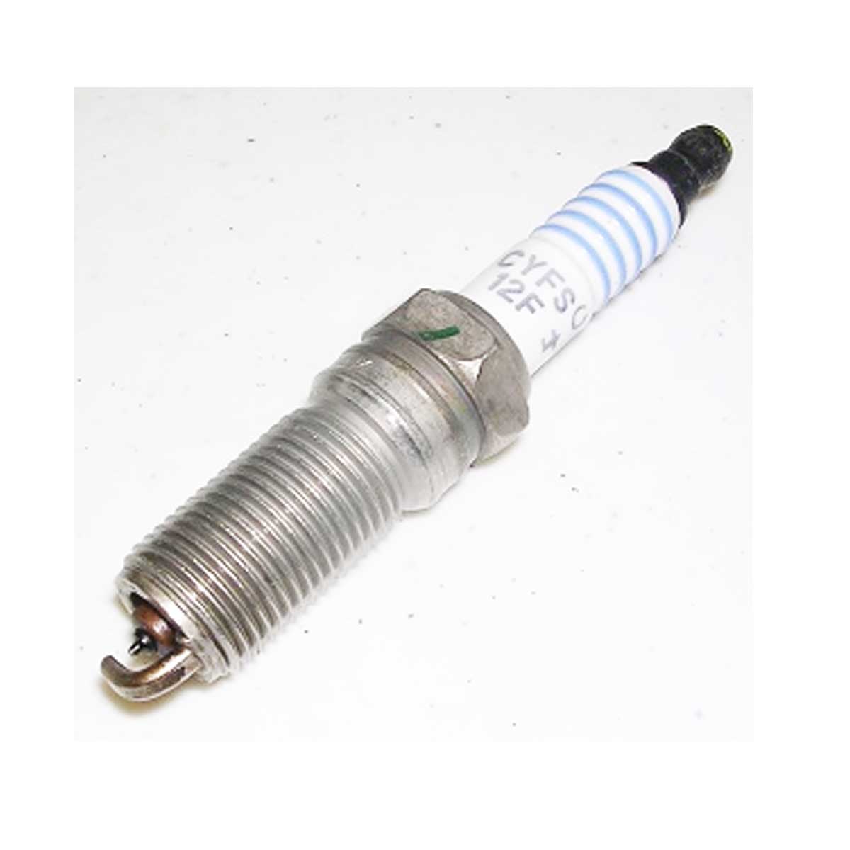 A set of 16 Indmar 6.2 Raptor Spark Plugs (CYFS-12-FP) with metal threaded bodies, white ceramic insulators, and exposed electrodes at the tip, displayed on a white background.