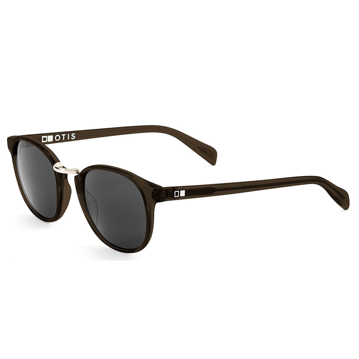 A pair of Otis A Day Late - Trans Tobacco/Grey Polar sunglasses made from handmade acetate, featuring round, grey polarized mineral glass lenses, 100% UVA/UVB protection, and the OTIS logo in white on the left arm near the hinge.