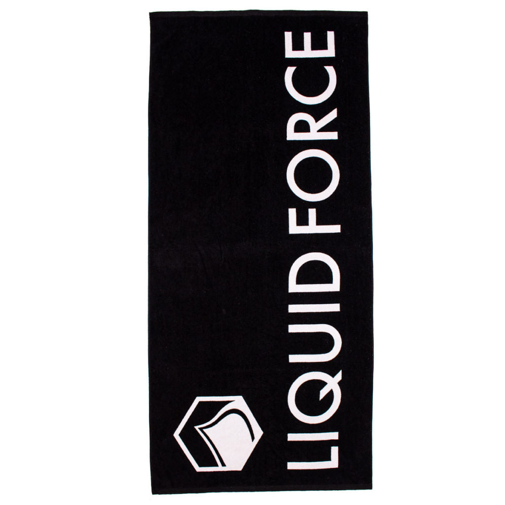 The Liquid Force Logo Towel is a black 100% cotton towel featuring "LIQUID FORCE" in large vertical white letters and a white hexagonal logo in the bottom left corner. Part of Liquid Force's fresh 2021 lineup.