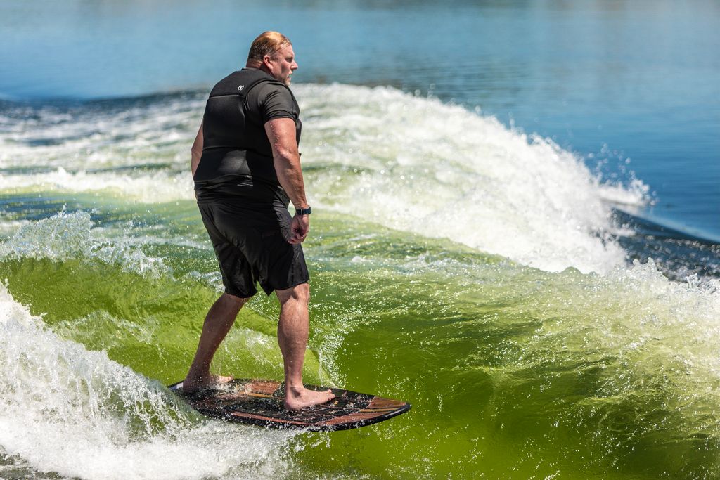 large person surfing