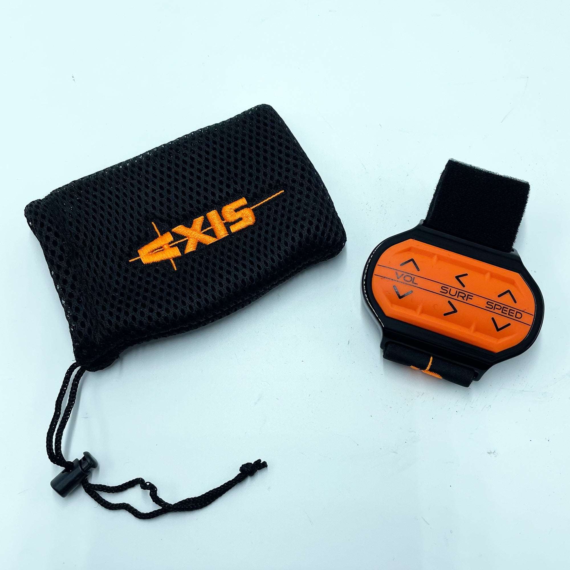 A small orange and black Axis Wake Surf Band 2017 with a pouch next to it that can adjust boat speed and perform wake transfers.