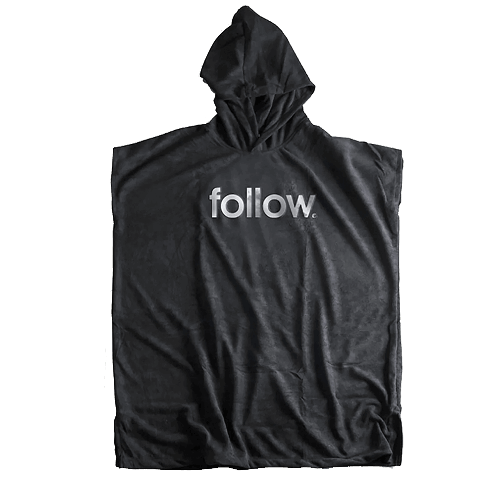 An embroidered logo of the word "Follow 3.13 Towelie - Black" adorns this sleek black poncho by Follow Wake.