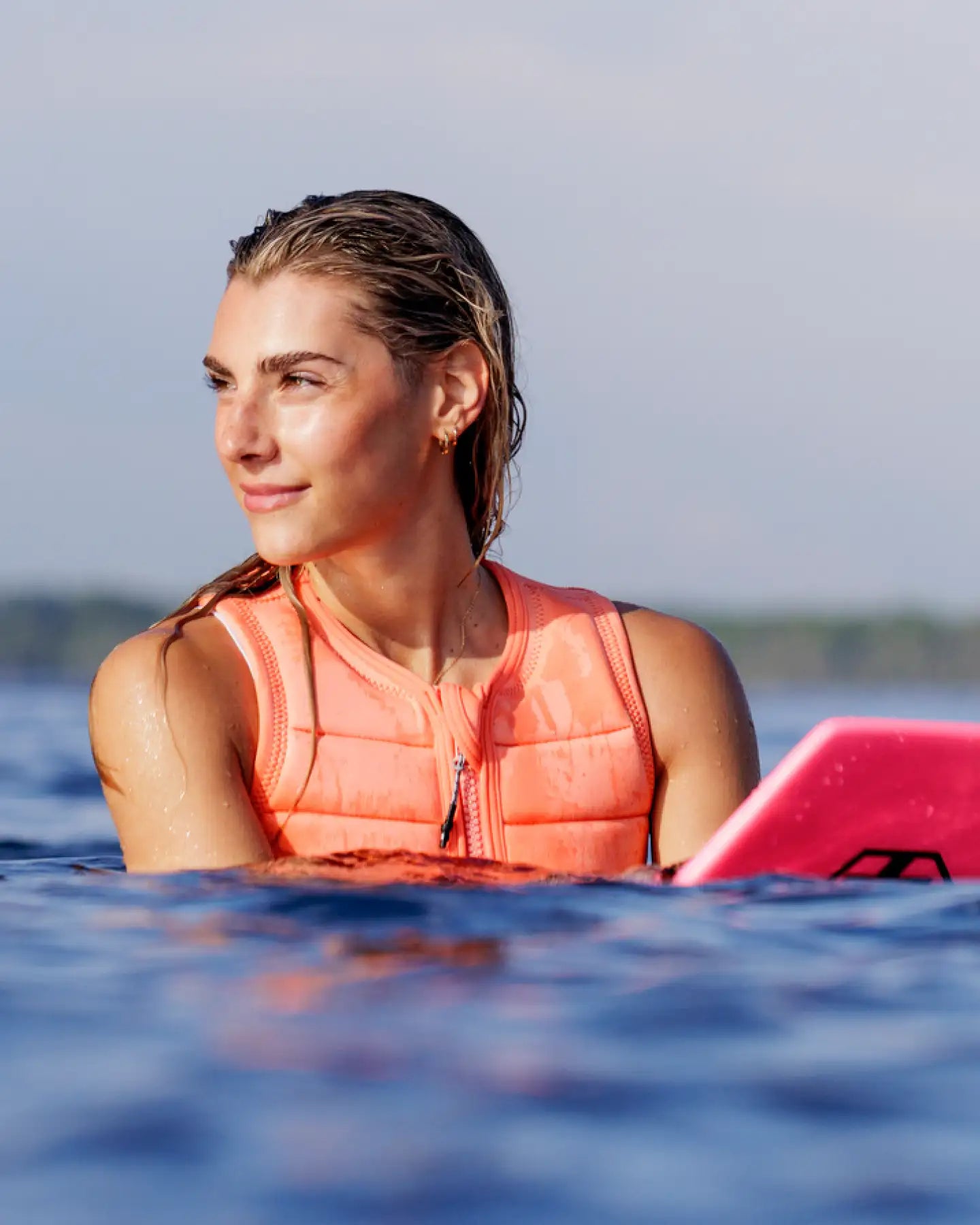 Cassidy Gale wakesurfs in the Follow Total Womens Impact Vest - Melon