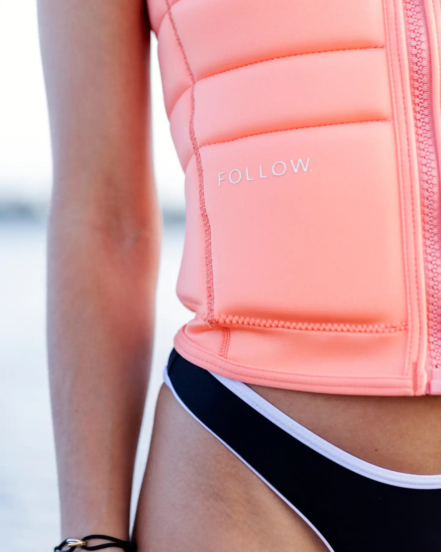 Close up detail shot of the Follow Total Womens Impact Vest - Melon