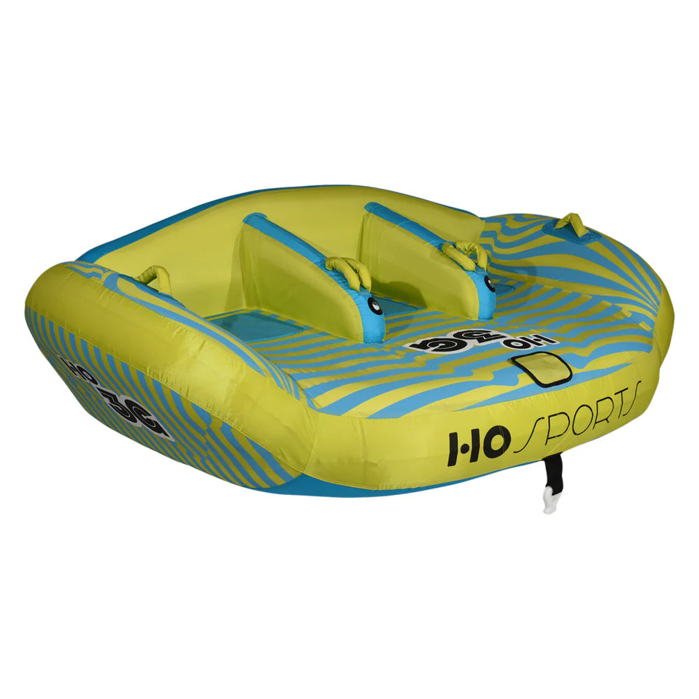 The HO Sports HO 3G Tube 2026 is a green and blue inflatable towable with striped patterns, a swept-wing design, two seating areas, handles, and "HO Sports" printed on the front and side.