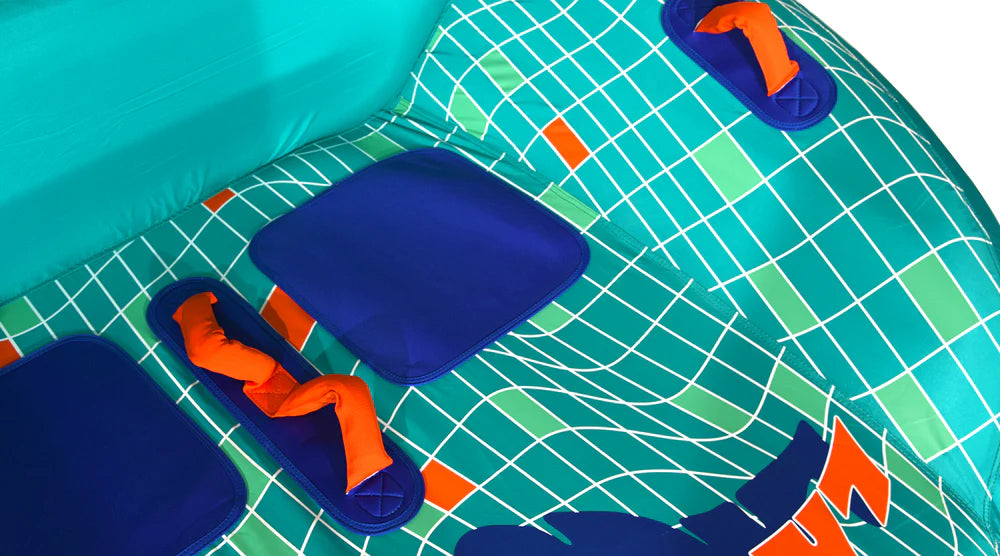 Close-up of the HO Sports HO Laguna 2 Tube 2026, a 2-person inflatable towable featuring a teal and green grid pattern, blue rectangular seats, and orange handles set on blue bases.