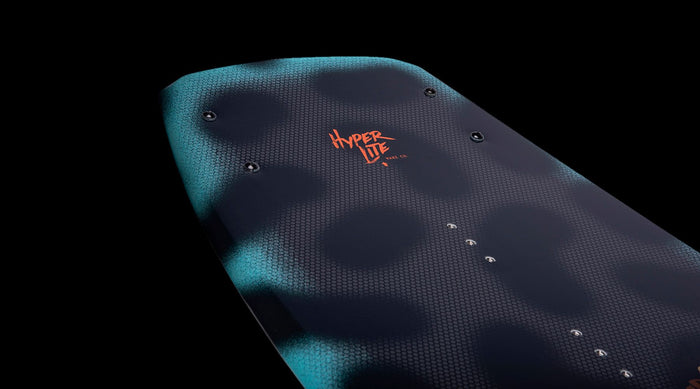 The back of a Hyperlite skateboard with a Hyperlite grom model featuring a blue and orange design.