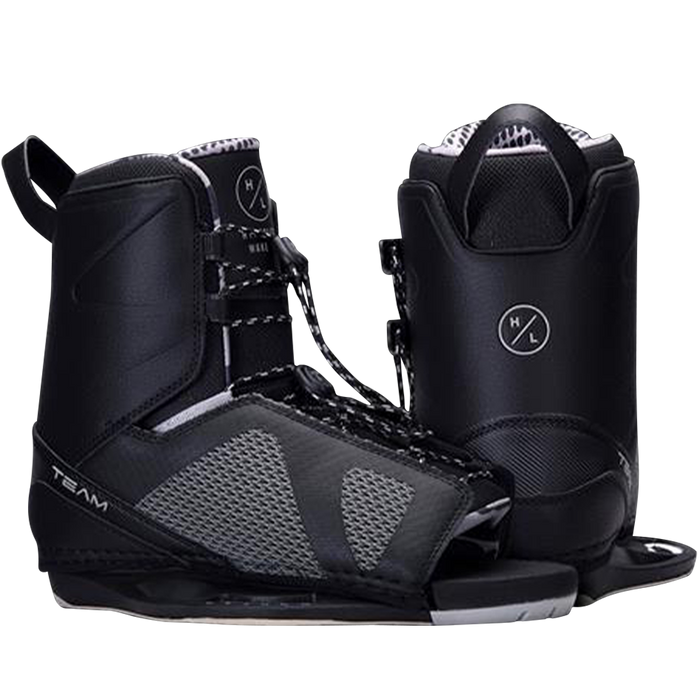 A pair of black and white wakeboard boots featuring the Hyperlite 2024 Rusty Pro Wakeboard | Team OT Bindings.