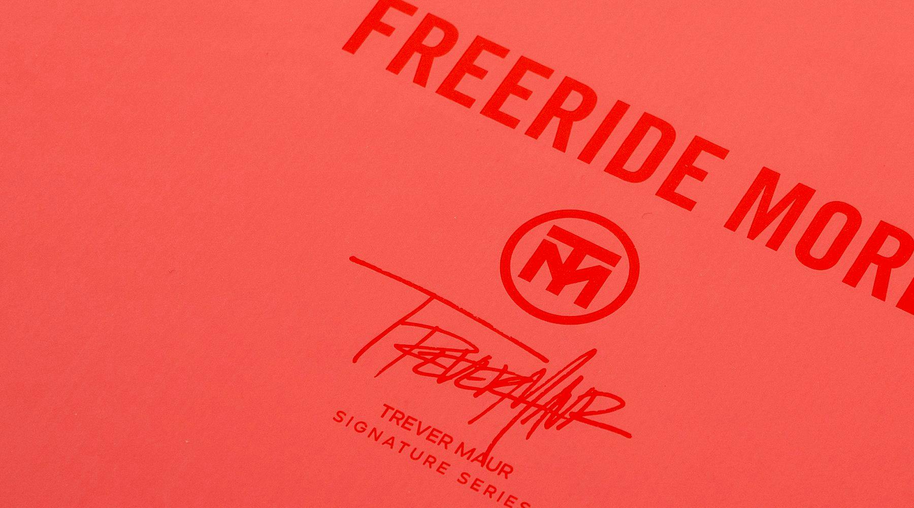 Featuring a red background with the text "FREERIDE MORE" and "TREVER MAUR SIGNATURE SERIES," this design includes a stylized TM logo and signature. The Hyperlite 2025 Blueprint Wakeboard is perfect for riders seeking the softest landing with ease during wake pops.