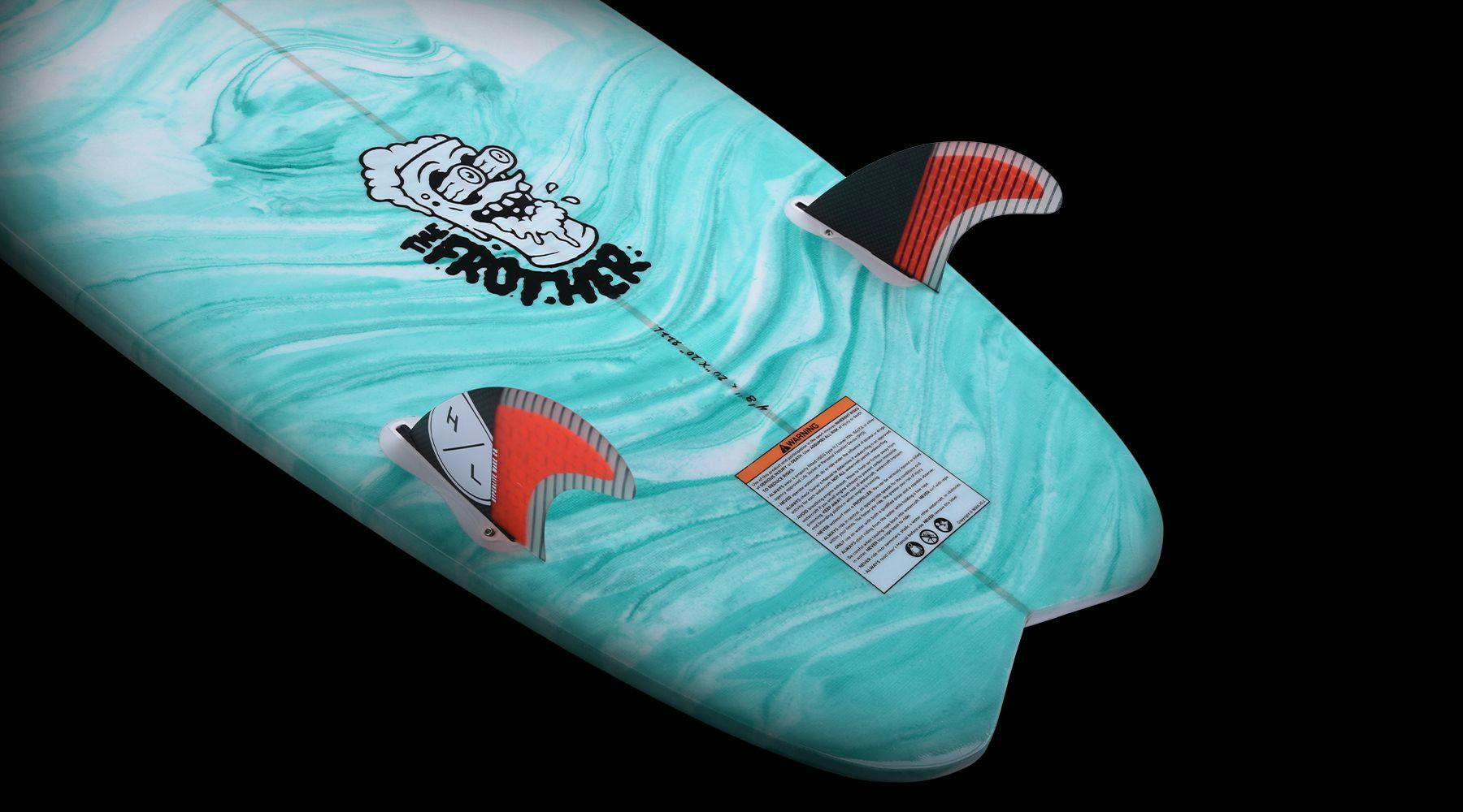 The Hyperlite 2025 Frother 2.0 Wakesurf Board is showcased in a close-up, displaying its light blue surface adorned with a cartoon graphic and orange fins. It features an innovative twin fin design set against a sleek black background.