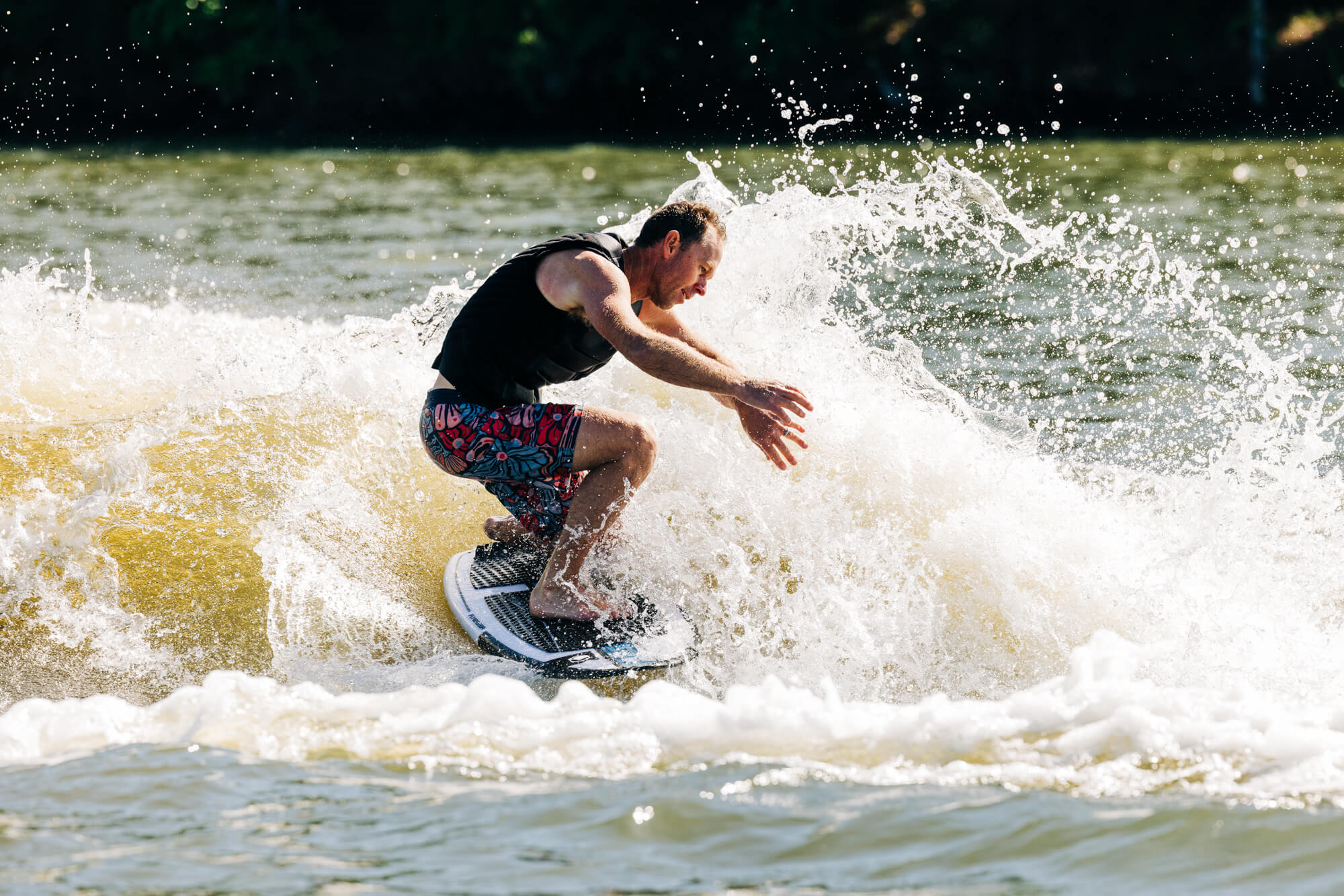 A man riding a wave on a Liquid Force 2024 Flyer Wakesurf Board (Pre-Order), showcasing incredible speed.