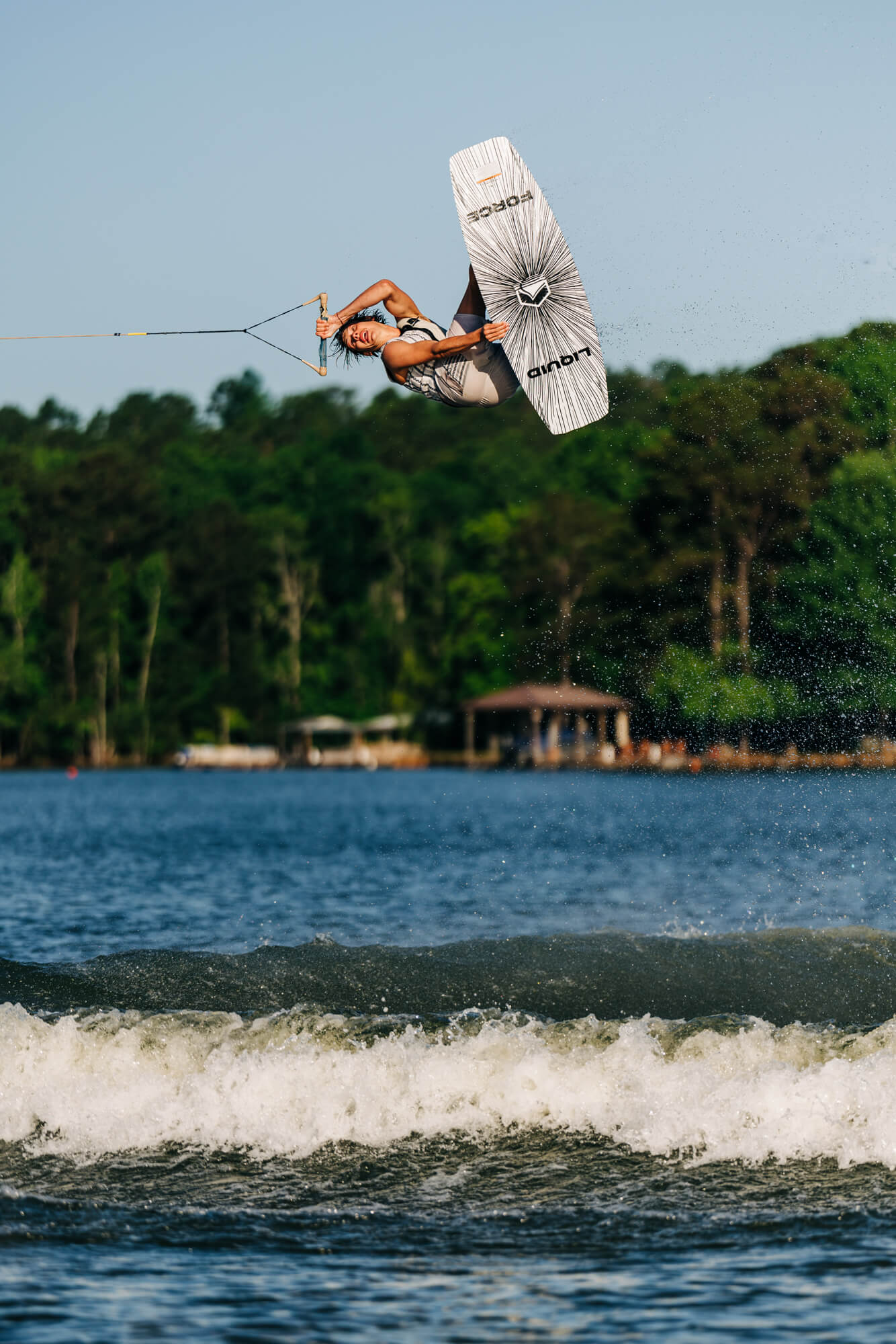 An individual enjoying wakeboarding with explosive pop and an aggressive continuous rocker on the Liquid Force 2024 Unity Aero Wakeboard (Pre-Order).