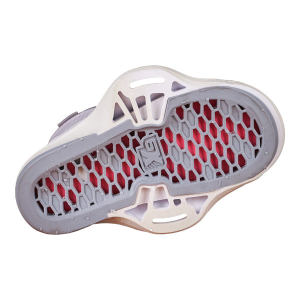 The image showcases a sneaker sole featuring a white and red honeycomb pattern, reminiscent of the innovative design seen in high-performance binding systems such as the Liquid Force 2025 Vida 6X Bindings by Liquid Force.