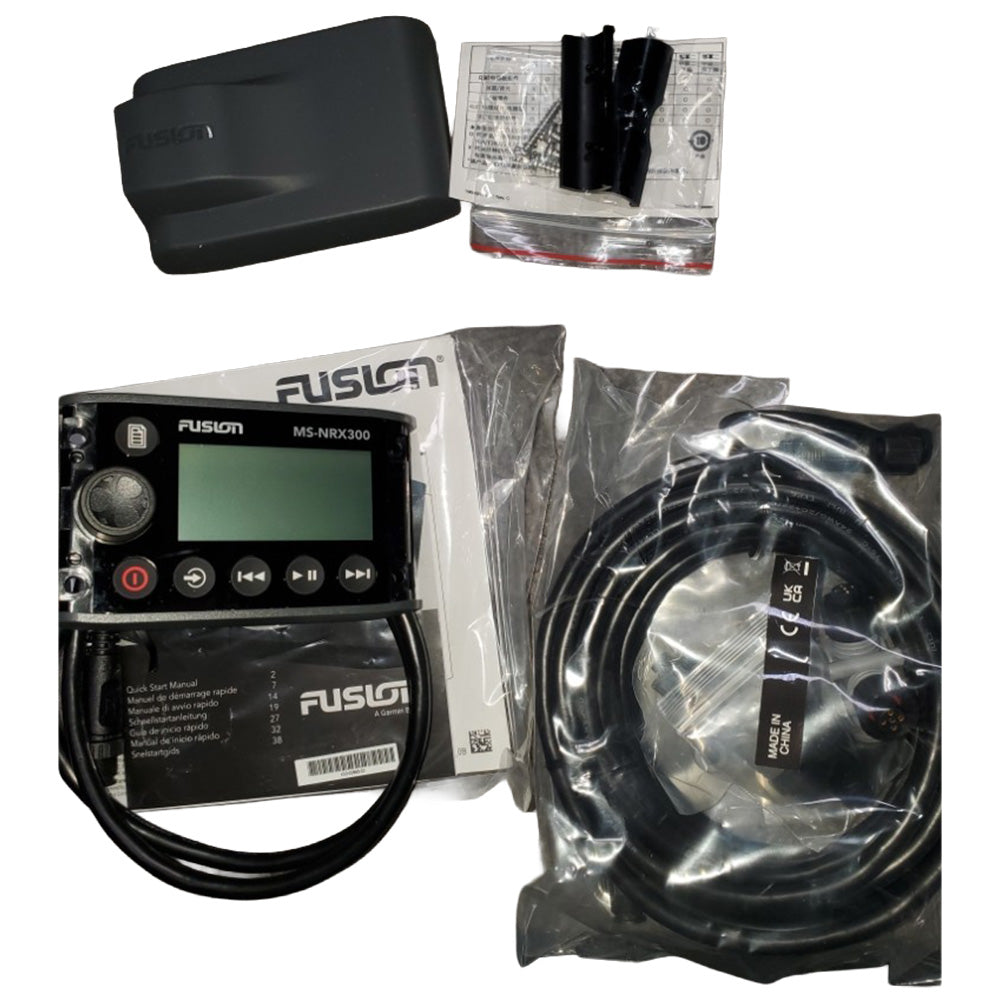 Moomba boats Fusion marine audio system components including a radio, cables, and a remote control on a white background.