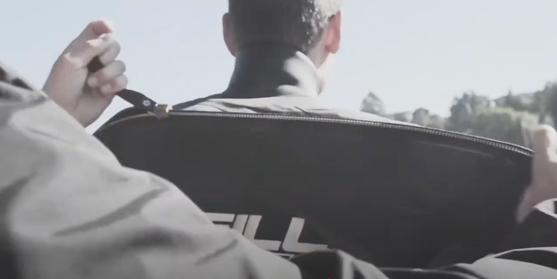 Man gets his O'Neill Boost Drysuit zipped up