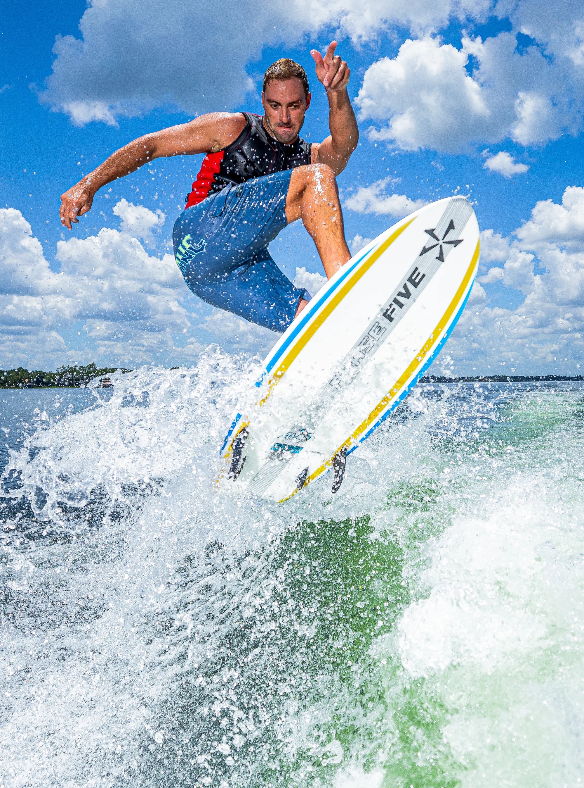 Jonn Akerman performs a shifty air off the wake on his Phase 5 2025 Ahi Wakesurf Board