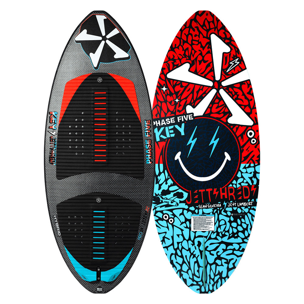 Two striking wakesurf boards display vivid designs. The left board, similar to the Phase 5 2025 Key Jett Shreds Wakesurf Board, features a black and gray geometric pattern with red accents and black foot pads. The right board boasts a bold red, blue, and black abstract pattern with eye-catching graphics, ideal for any wakesurfer.