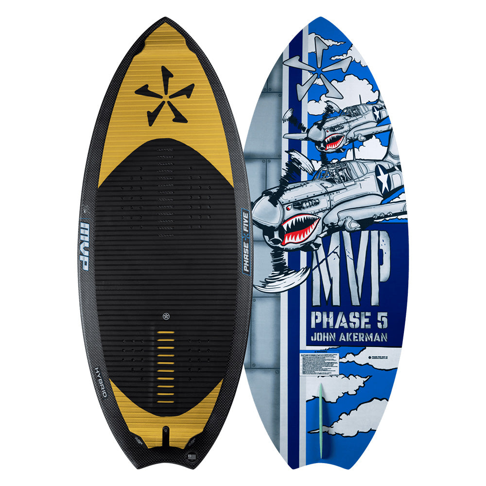 Two skimboards: one featuring a black and yellow geometric design with Hybrid Carbon, and the other showcasing a blue and white shark airplane graphic with Techno Traction V2, prominently featuring the text on the Phase 5 2025 MVP Wakesurf Board by Phase Five, endorsed by John Akerman.