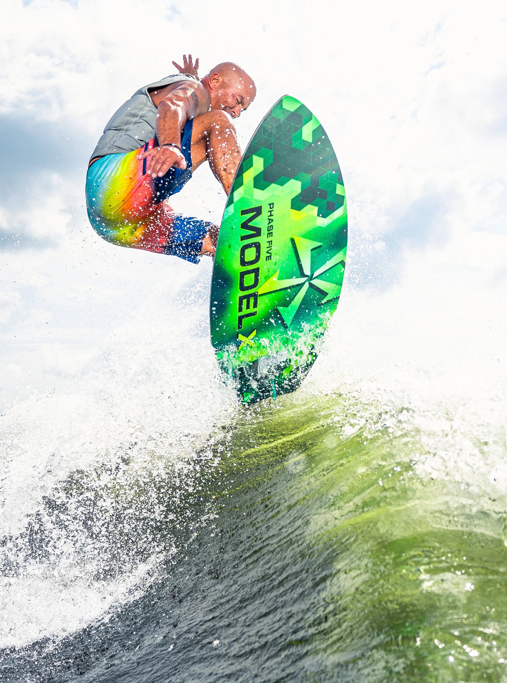 Athlete airs out of the wake on his Phase 5 2025 Model X Wakesurf Board