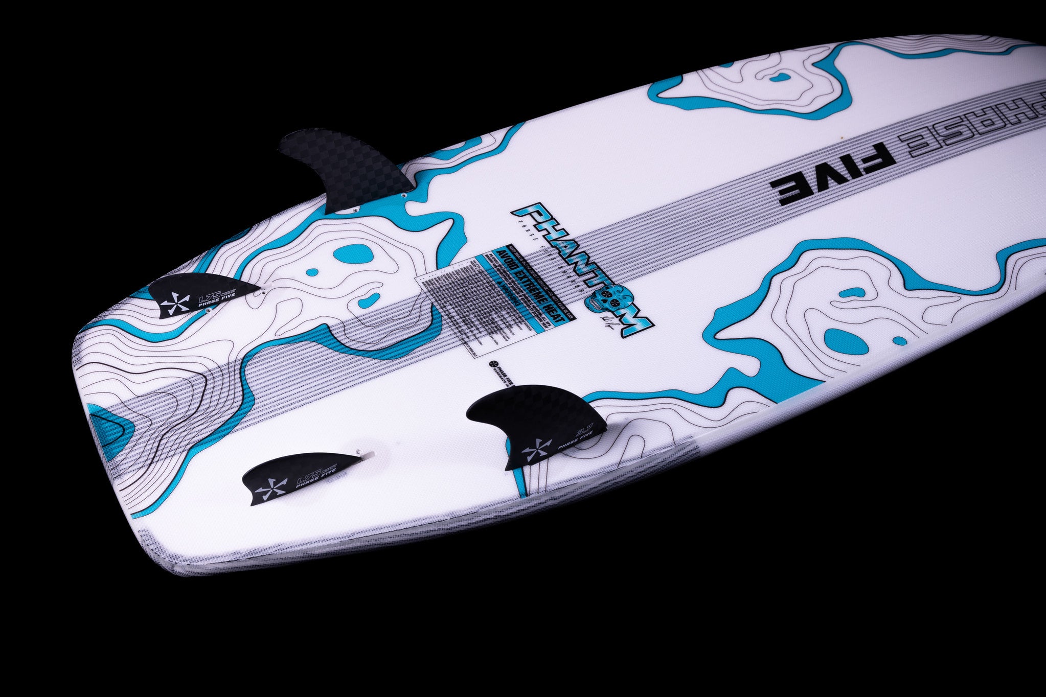 Introducing the Phase 5 2025 Phantom Wakesurf Board, highlighting a captivating blue and white topographical design against a sleek black backdrop. With PHANTOM and CHASE FIVE proudly displayed, this board comes equipped with three fins to ensure peak performance, ideal for adventurous spirits like Parker Payne.