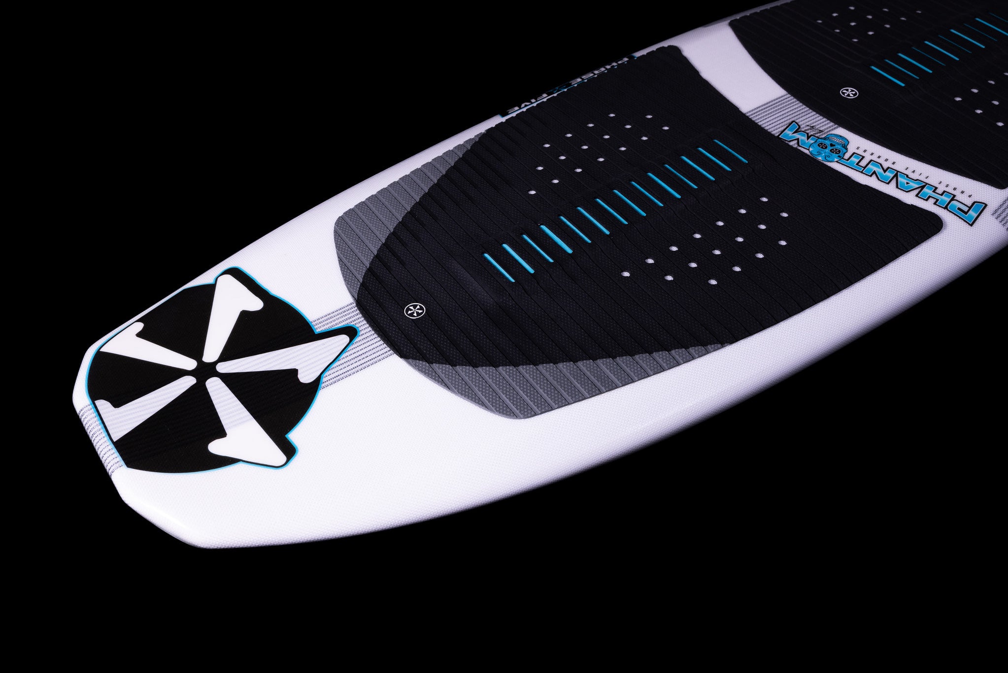 Close-up of a Phase 5 2025 Phantom Wakesurf Board featuring black and blue accents and textured pads, set against a black background, reminiscent of Parker Payne's style.