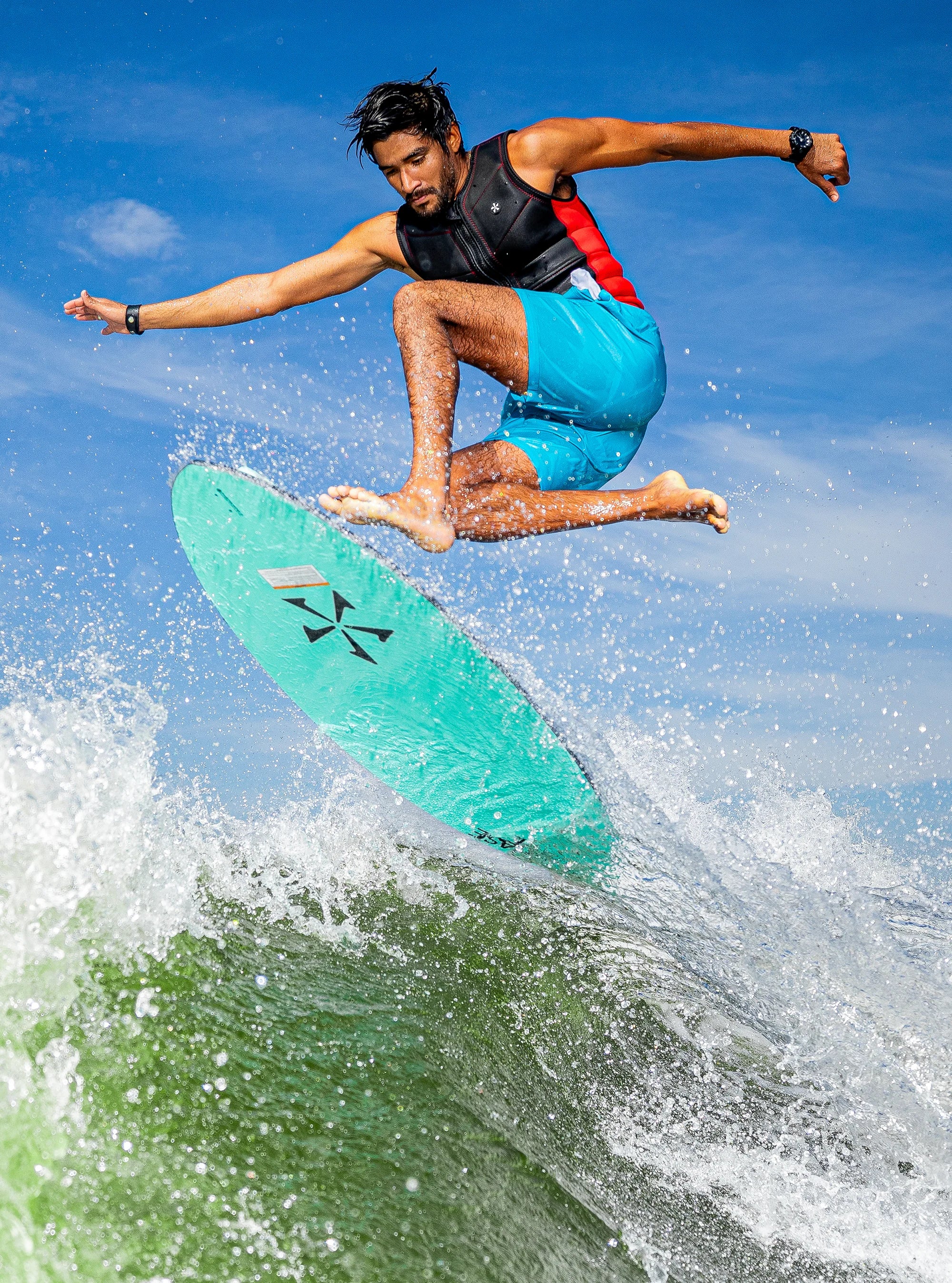 Athlete performs a pop shuv it on his Phase 5 2025 Matrix Wakesurf Board
