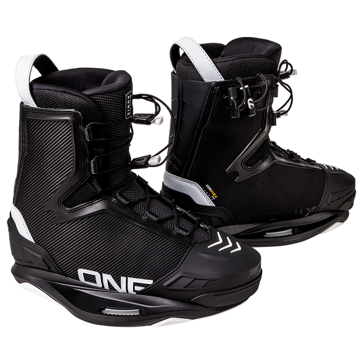 A pair of Ronix 2025 One Legacy Wakeboard boots, in black and white, with laces and Velcro straps, featuring the text "ONE" on the side, designed for ultimate performance on the slopes.