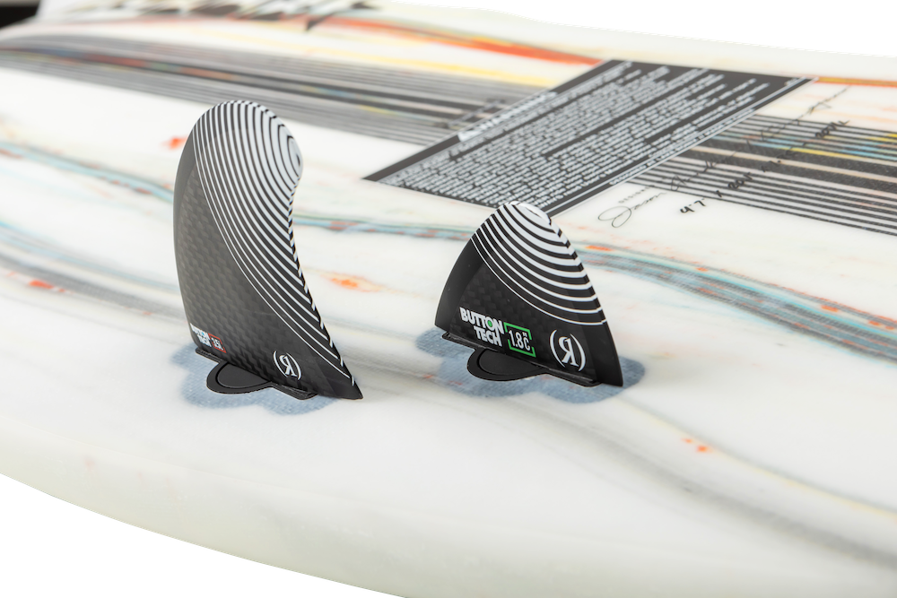 Close-up of two black surfboard fins with white striped patterns on the Ronix 2025 Flyweight Atlantik Wakesurf Board, designed for the high-performance surfer.