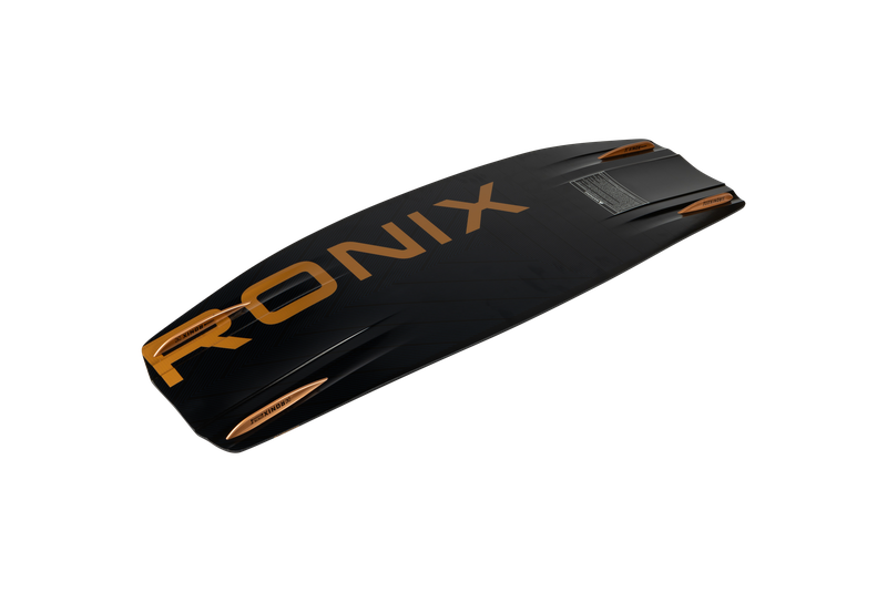 A black Ronix 2025 One Blackout Wakeboard prominently features the RONIX logo in large orange lettering across the surface. It is designed with textured details and bright orange accents along the sides, leveraging advanced Blackout Construction for superior performance.