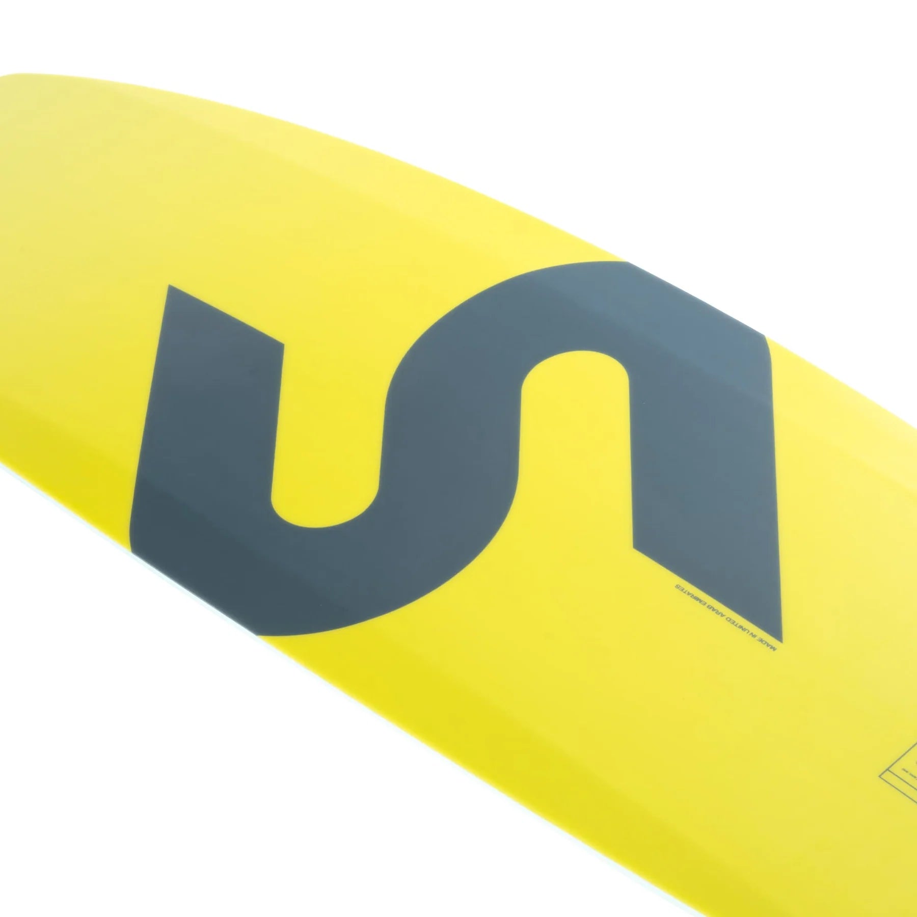 Close-up of a yellow Slingshot 2025 Bearden Wakeboard, featuring a large black stylized S design and smooth chined rails for enhanced performance.