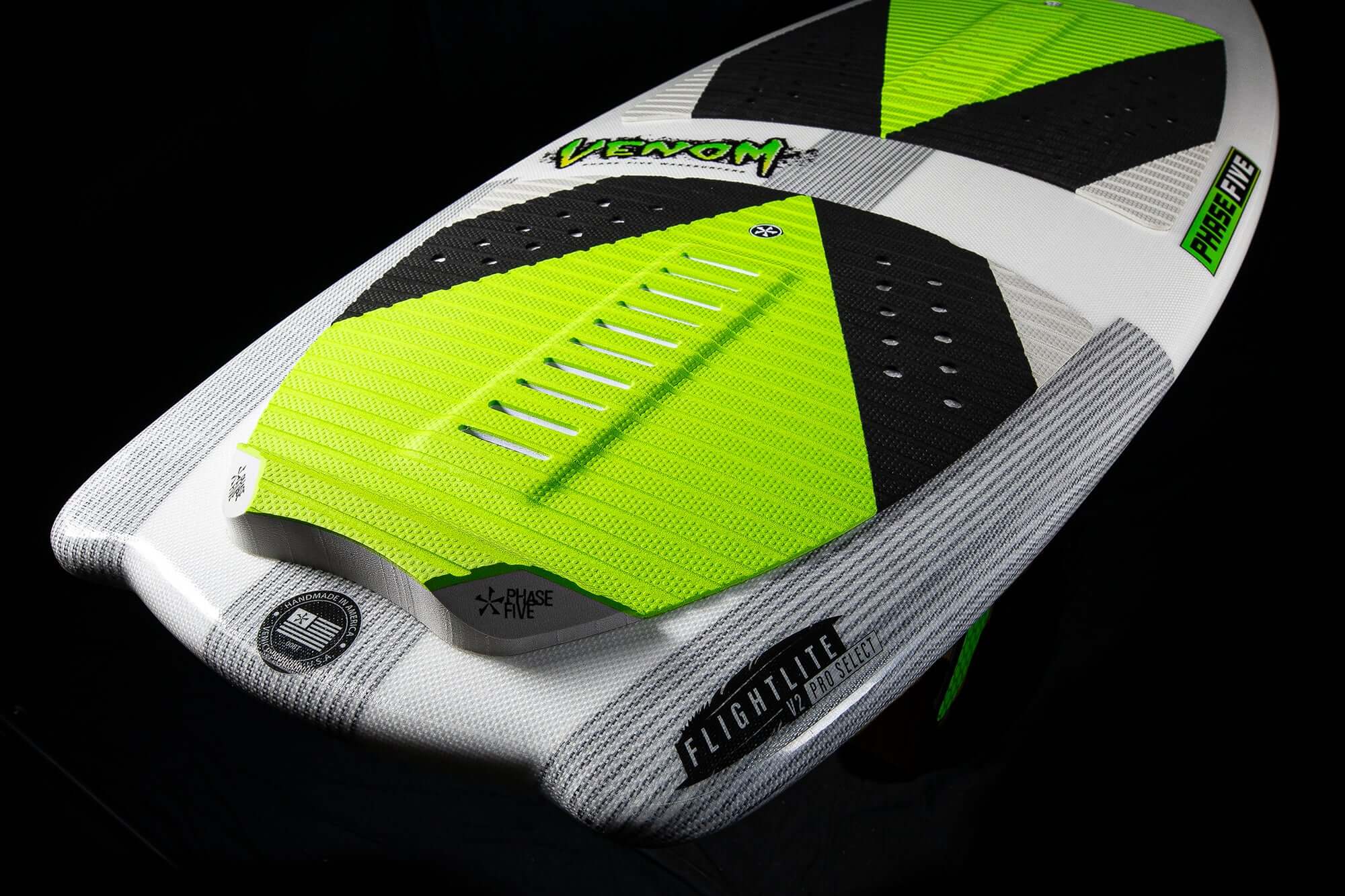 A high performance surfer Phase 5 Venom wakeboard on a black background.