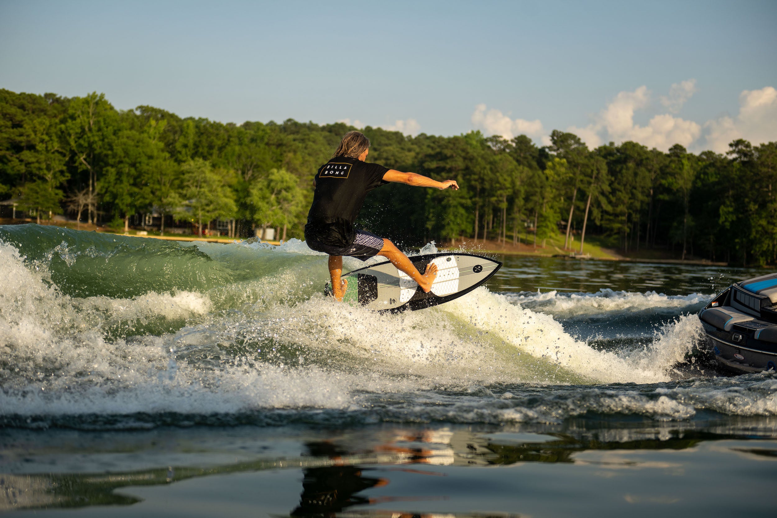 An Hyperlite 2023 Automatic Wakesurf Board rider riding a wave in Florida.