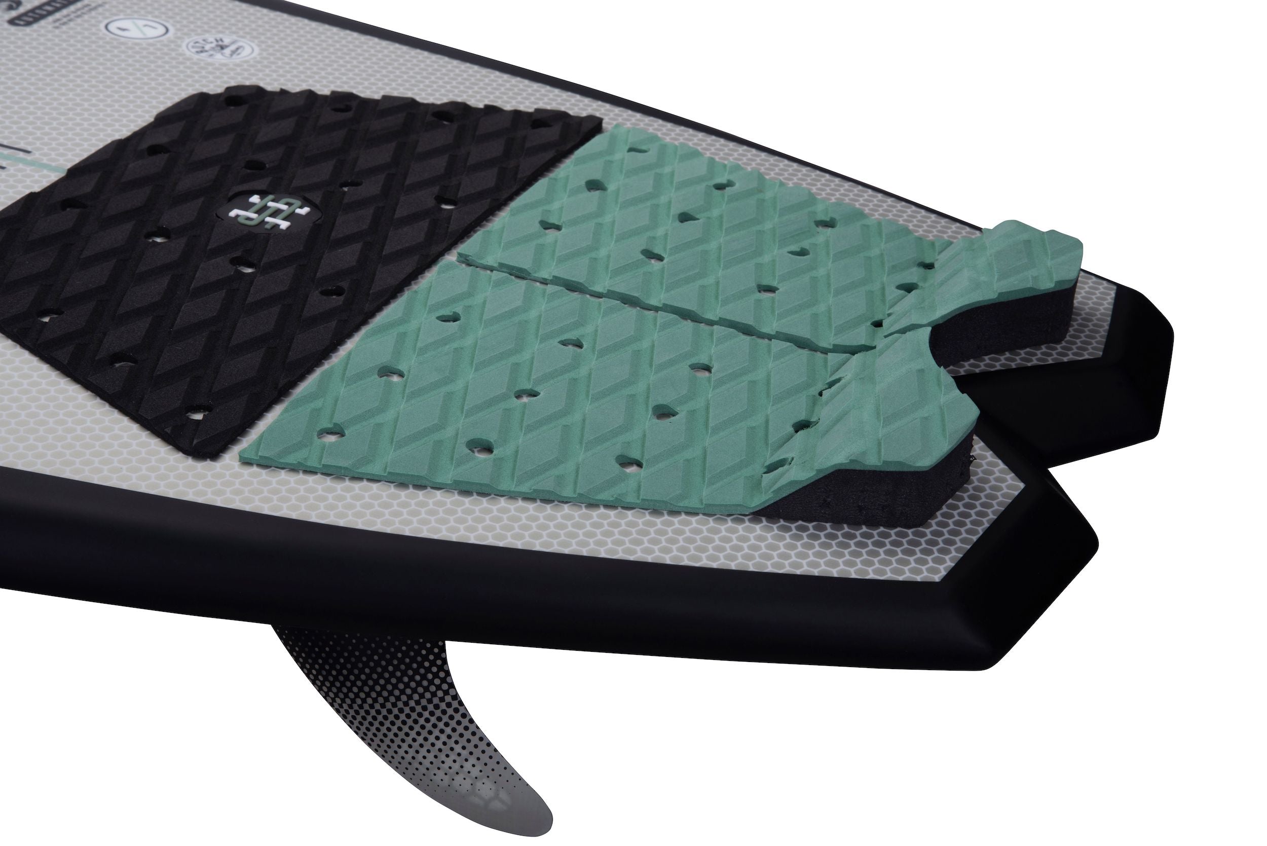 A Hyperlite 2023 Automatic Wakesurf Board with a green and black pad on it, made with DuraShell Construction.
