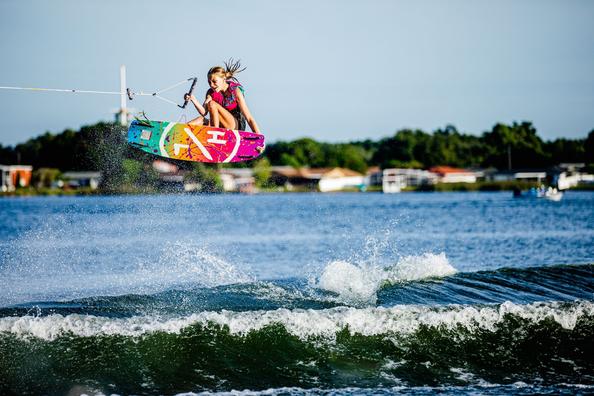 A Lil It Girl is riding a Hyperlite 2024 Murray Girls Wakeboard.