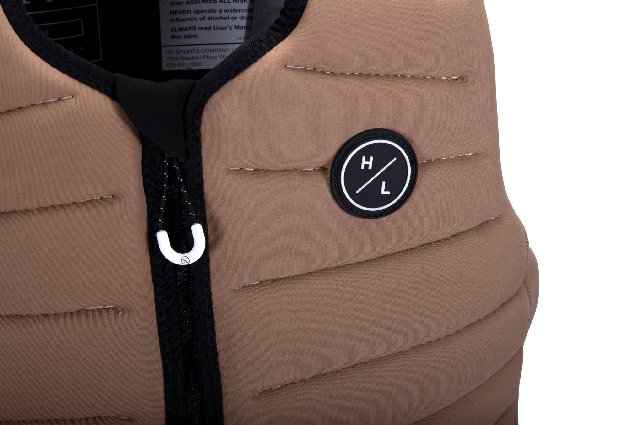 The Hyperlite 2024 NCGA Relapse Vest is a lightweight tan vest with a black logo on it.