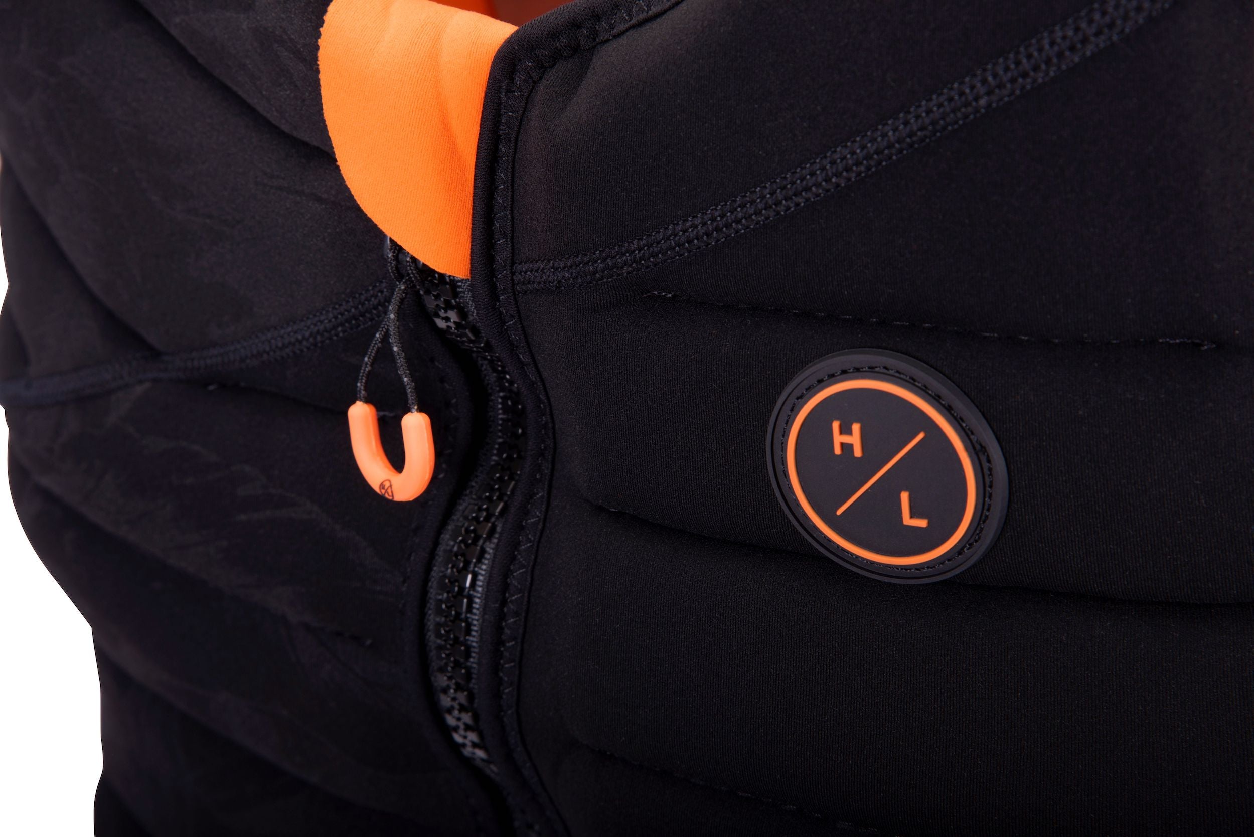 A Hyperlite 2024 NCGA Women's Cadence Vest with an orange logo on it.