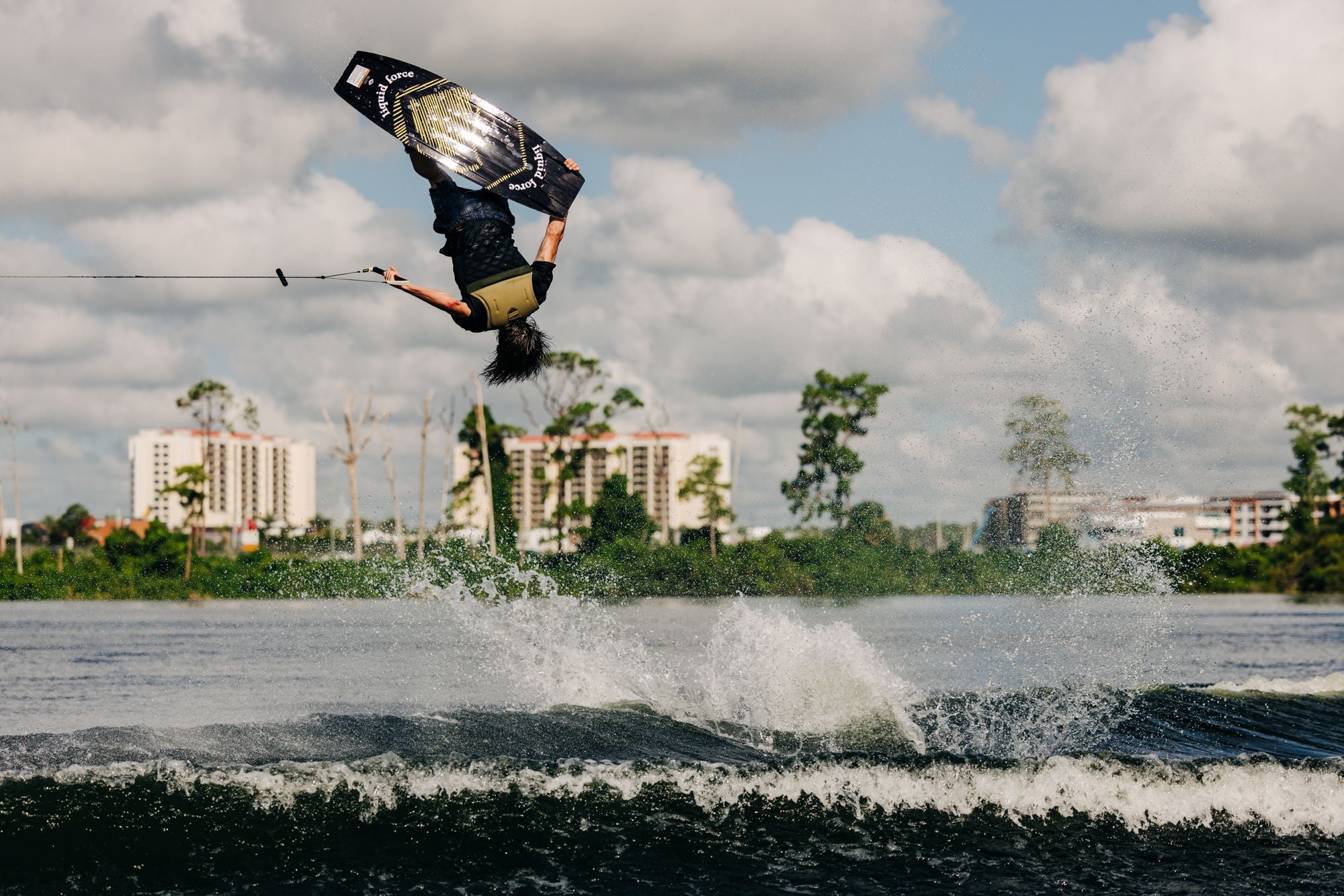 A person wakeboarding with explosive pop off the top and aggressive edge control using the Liquid Force 2024 Bullox Wakeboard.