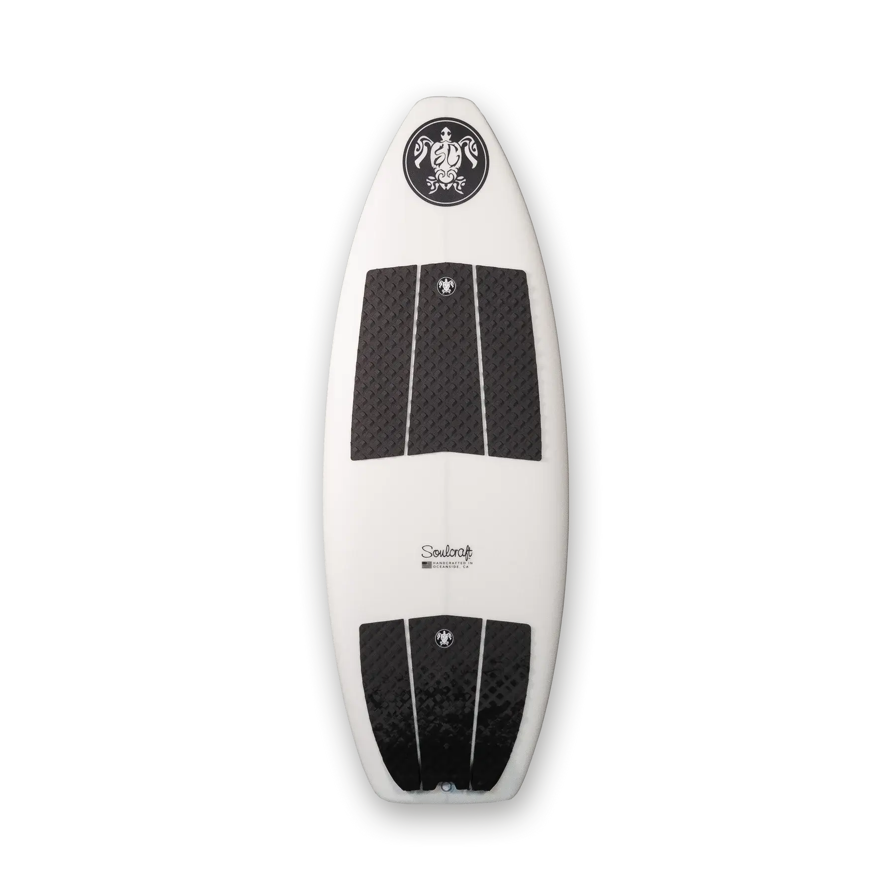 A white and black Soulcraft M2 Wakesurf Board carving through the water during surf comps.