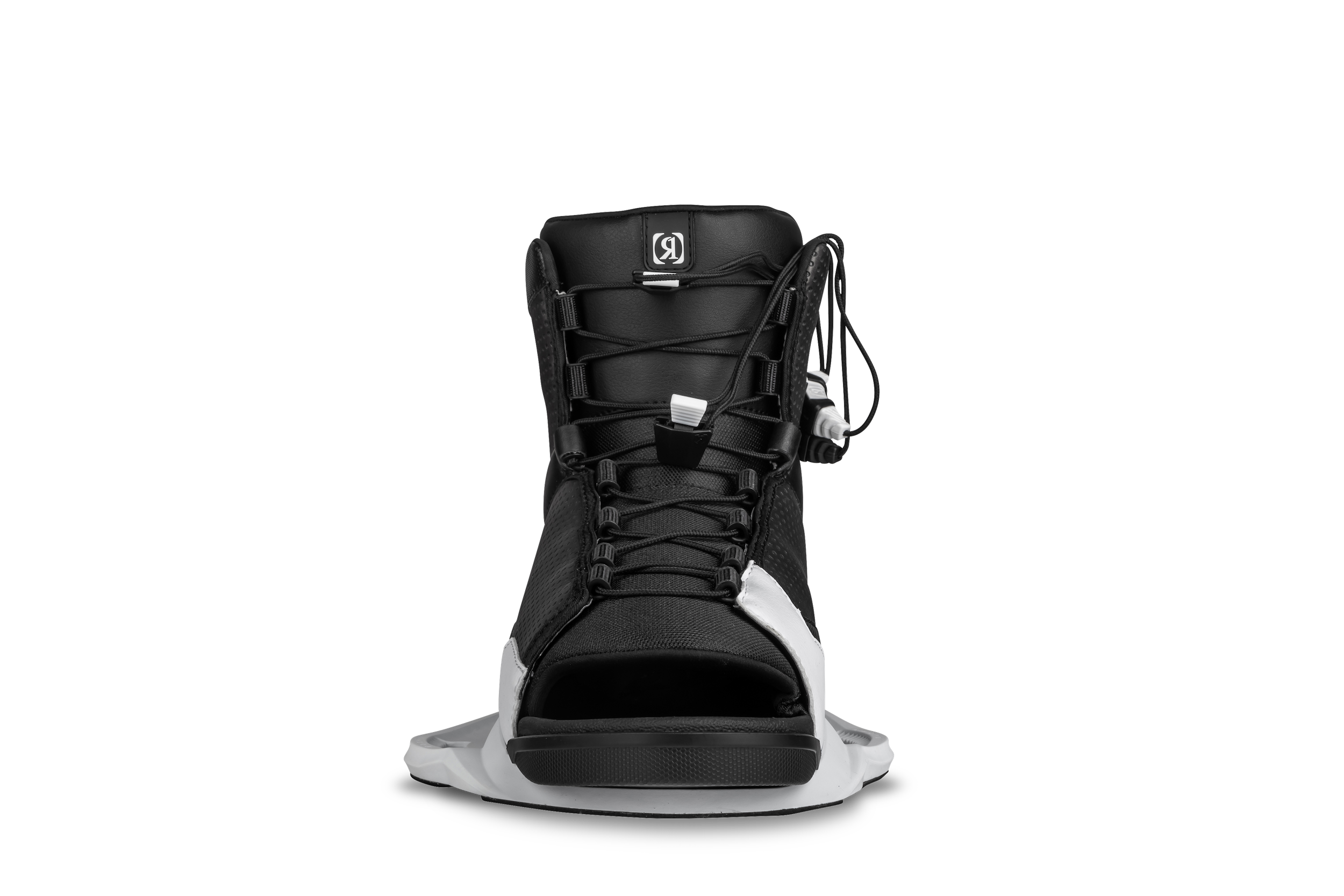 A black and white sneaker on a black background featuring Ronix 2024 District Bindings technology.