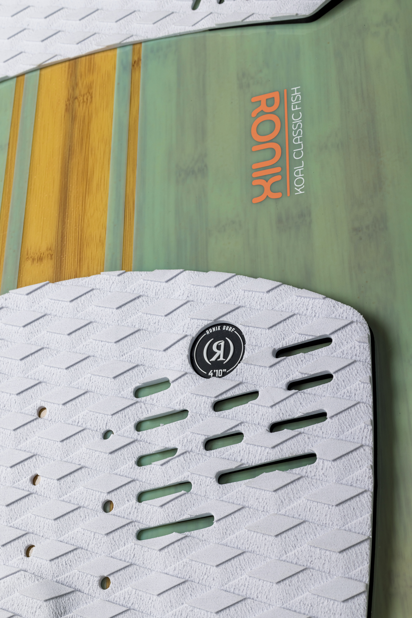 A funboard with a Ronix 2024 Women's Koal Fish Wakesurf Board, designed in surf style.