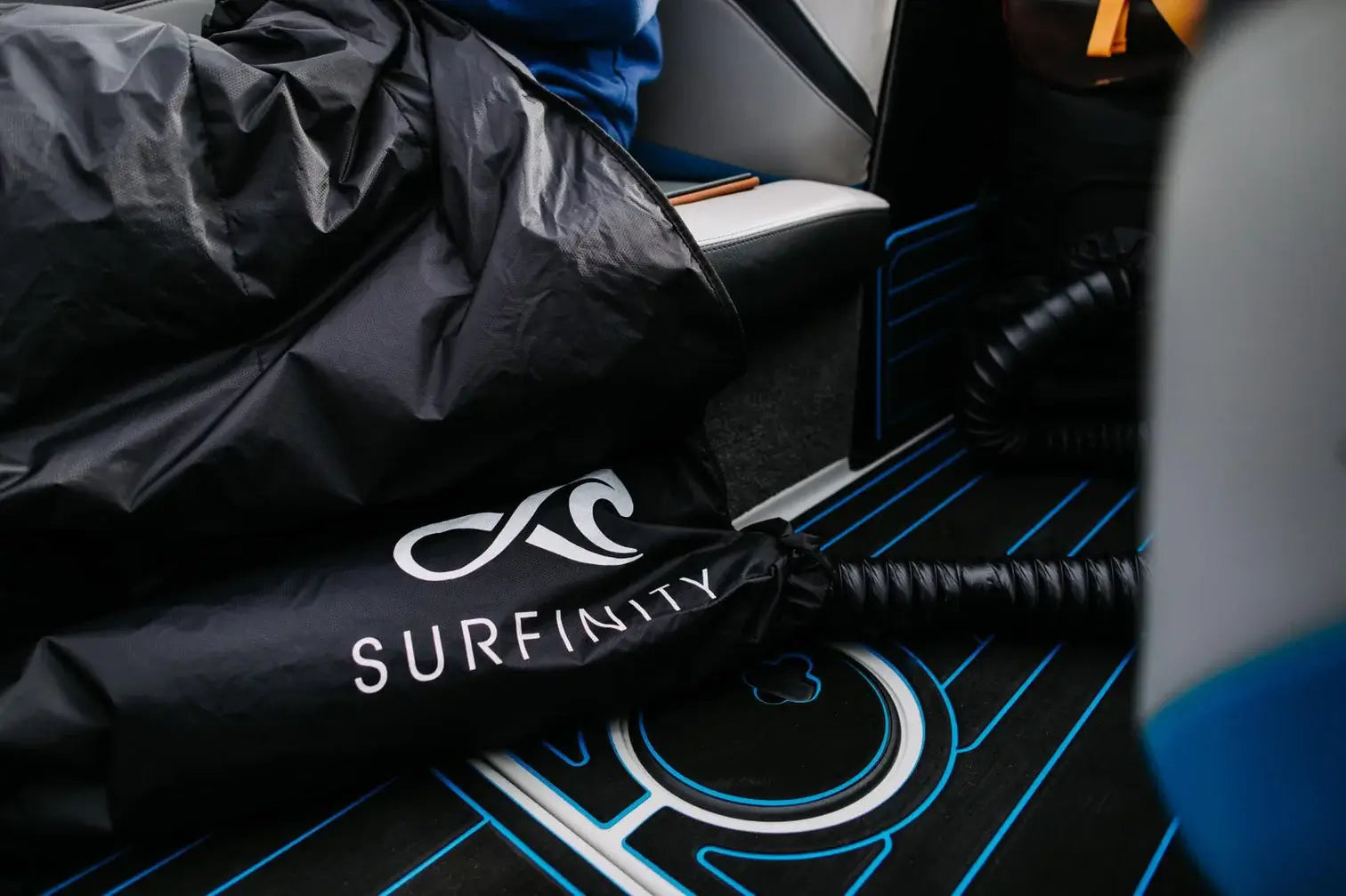A wind-proof Malibu bag with the word Surfinity on it.